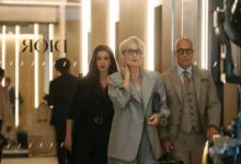 Stylish fashion editor in a modern office reviewing digital magazine layouts, representing the evolution of fashion media in The Devil Wears Prada 2