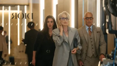 Stylish fashion editor in a modern office reviewing digital magazine layouts, representing the evolution of fashion media in The Devil Wears Prada 2