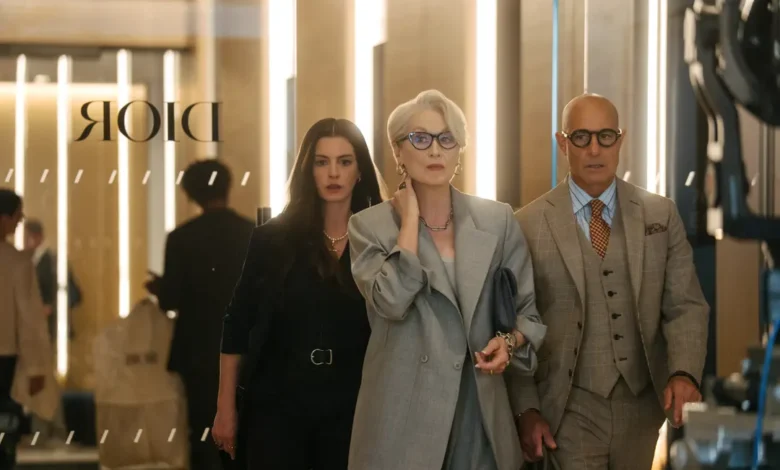 Stylish fashion editor in a modern office reviewing digital magazine layouts, representing the evolution of fashion media in The Devil Wears Prada 2