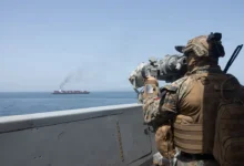 Naval ships navigating a strategic sea route with visible tension, representing global maritime security and geopolitical challenges