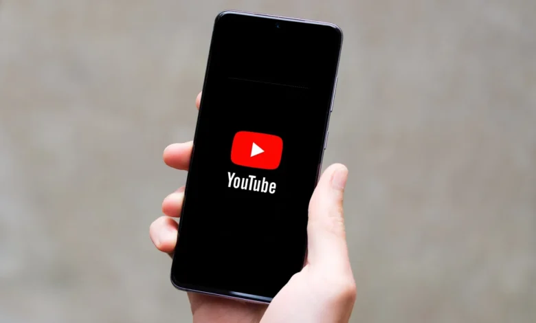 Smartphone screen showing a floating YouTube video window while the user browses other apps, illustrating picture-in-picture multitasking